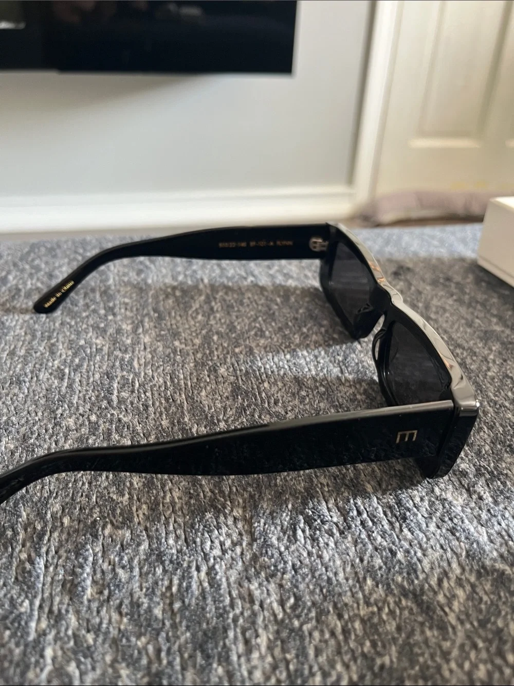 Black Rectangular Women's Sunglasses with White Case